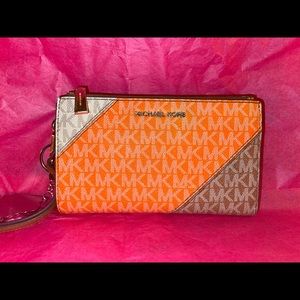 Michael Kors orange and brown hand wallet